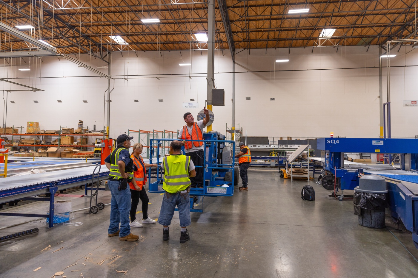 VHH crew working from a lift inside a warehouse facility